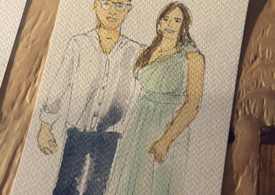 Illustration aquarelle d’un couple de mariés réalisée en live drawing dans une grange rénovée en Alsace.
